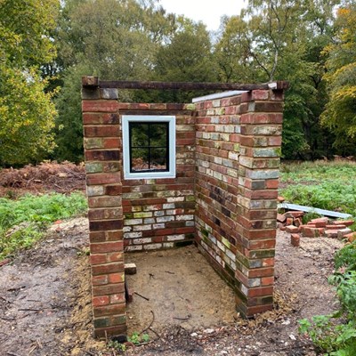 Young Ambassador Alex in front of scaffolding