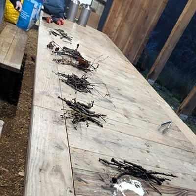 Enjoying a cup of hot chocolate round the camp fire