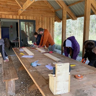 The group takes part in a team building exercise